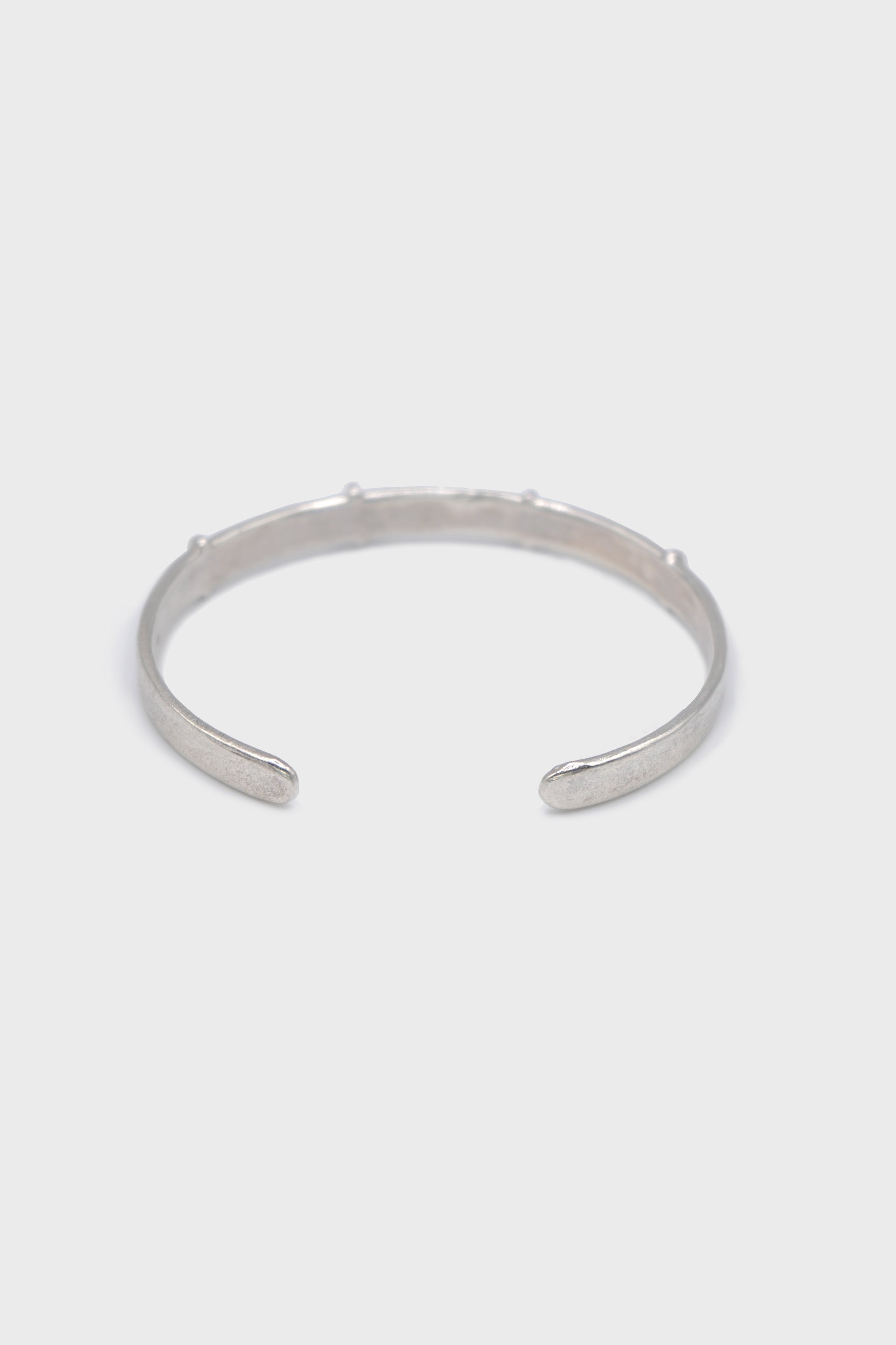 THIN SILVER STITCHED CROSS SILVER BANGLE